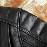 Close-up of ventilation system, quilted shoulders, and YKK hardware