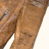 Arm view of the SOVR Leather distressed brown café racer leather jacket featuring premium genuine leather, stand-up snap-tab collar, YKK front zipper, zippered pockets, and a vintage distressed finish.