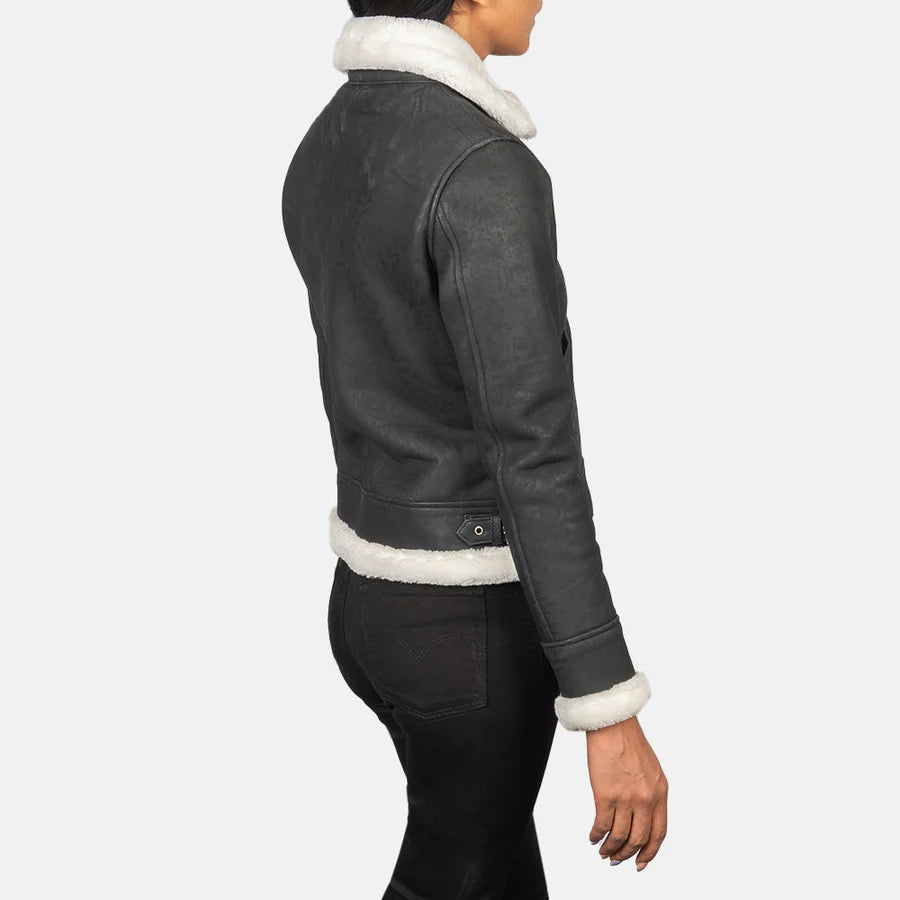 Back view of women's black and white leather bomber jacket