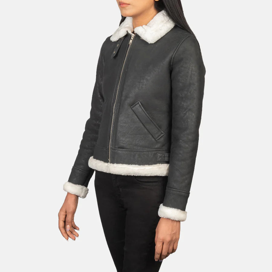 Side profile of women's black leather shearling bomber jacket