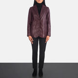 Side profile of women's tailored maroon leather blazer